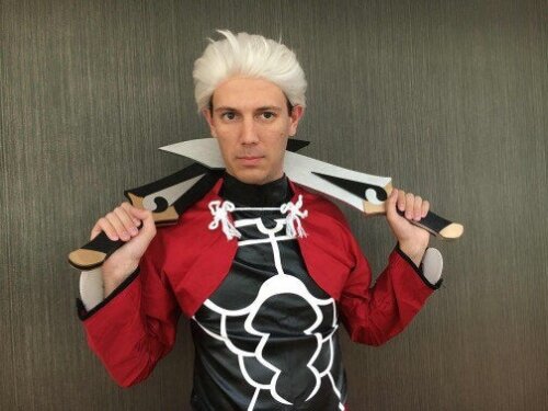 Cosplayer holding our Archers Swords from anime Fate/ Stay Night