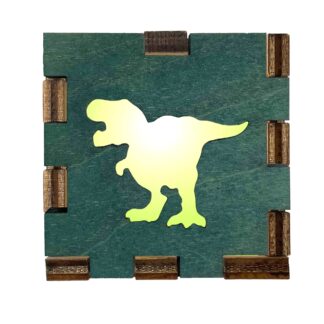 Green-stained wood light box with a T-Rex dinosaur cutout glowing from behind.