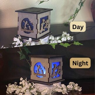 Calvin & Hobbes Wooden 5" Light Up Gift Box that is cut through on two sides with colored filter to light up as it gets dark.