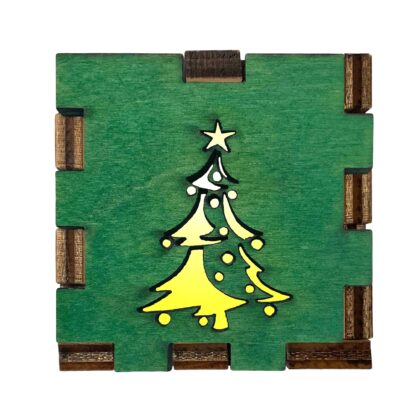 Interactive wooden light box with green-stained Christmas tree front, glowing with yellow filter light.
