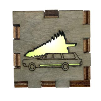 Christmas Vacation Interactive Light Box with grey-stained wood front showing classic station wagon and tree, glowing with yellow light.