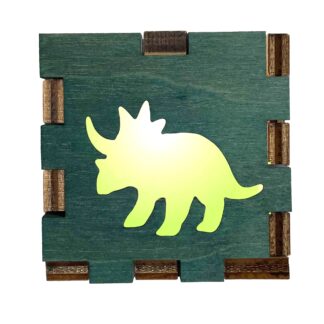 Wooden light box with green-stained front and cutout of a glowing Triceratops dinosaur design.