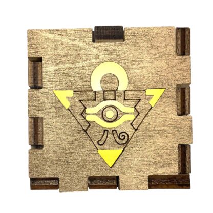 Yu-Gi-Oh! Millennium Puzzle Light Box with gold-stained wood front and glowing yellow filter inside
